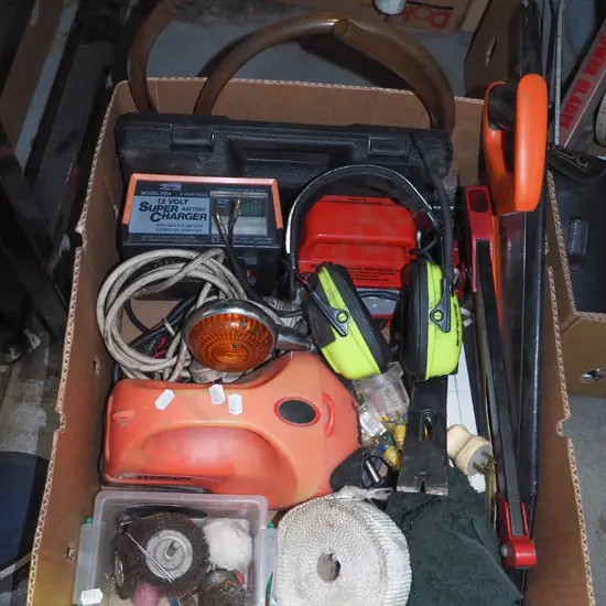box; ear muffs, hack saw, hand saw, battery charger etc