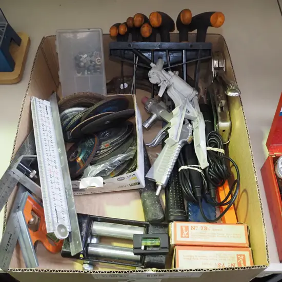 box; builder's squares, rulers, grinding discs