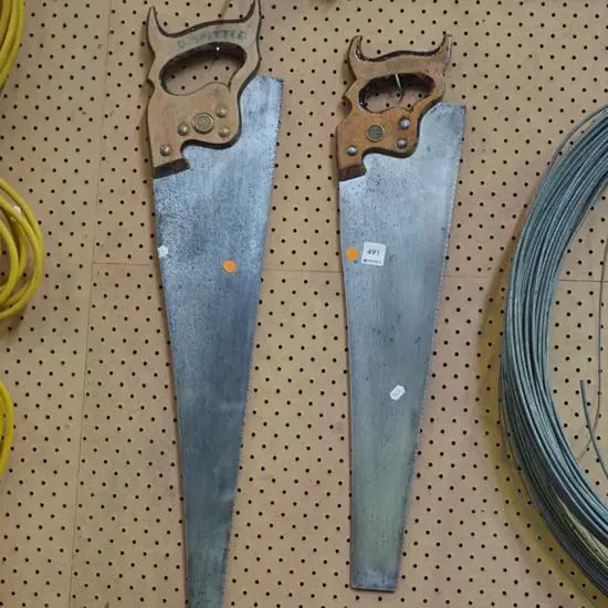 2x hand saws - orange dots