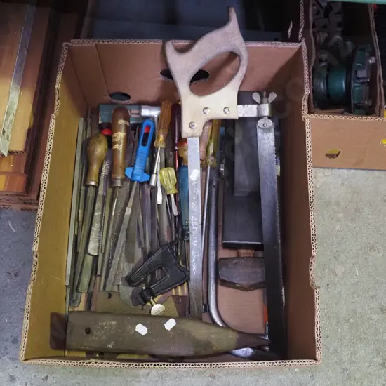 box; anvil, bone saw, sharpening stone, files etc