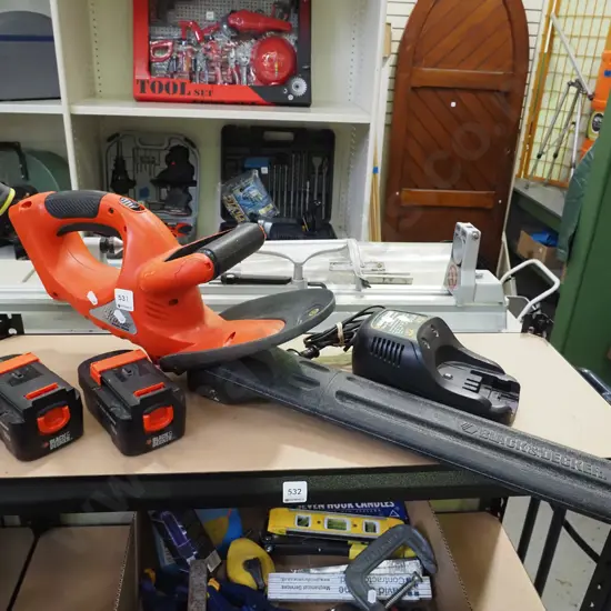 Black & Decker Fire storm electric hedge trimmer with 2 batteries and chargers - batteries in office