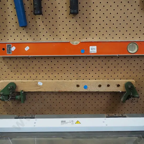 small clamp and builder's level - blue dots