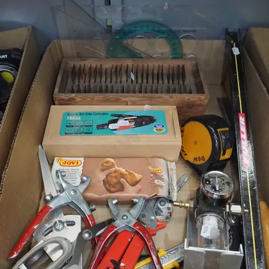 box; air grinder, copper alphabet stencils, tape measure, chisels etc