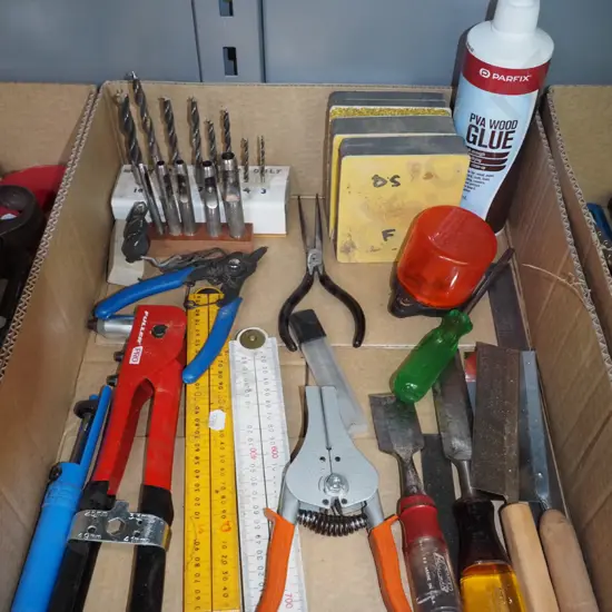 box; builder's rulers, chisels, sanding blocks etc