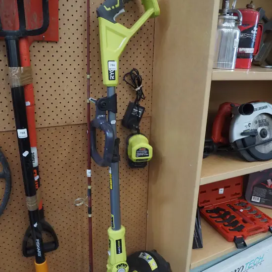 Ryobi battery powered line trimmer - battery in office