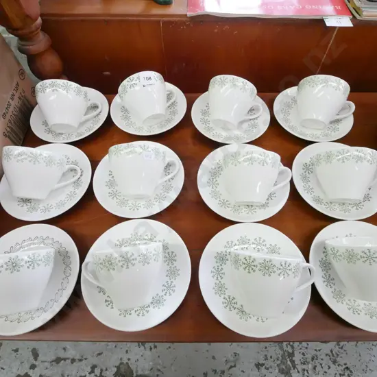 12x Kelston pottery snowflake cups and saucers