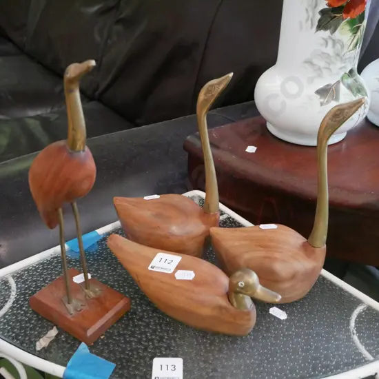 assorted wood and brass bird figurines