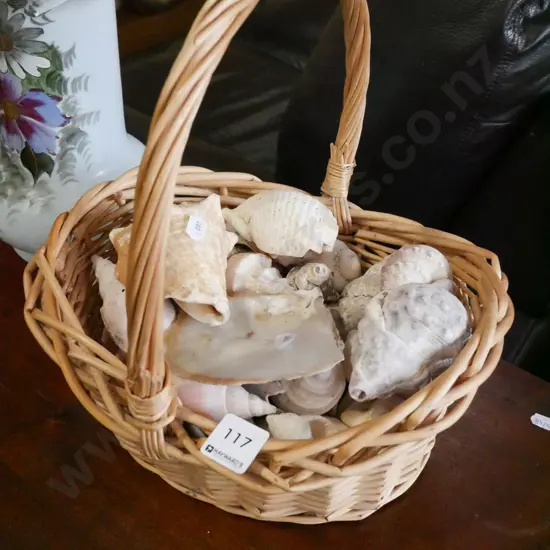 small cane basket and seashells