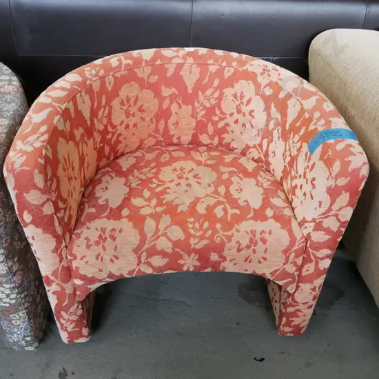 orange and yellow floral upholstered tub chair
