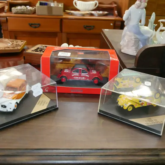 3x boxed model vehicles