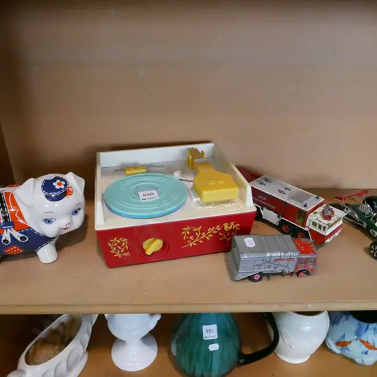 shelf of childrens toys, record player, racing car etc
