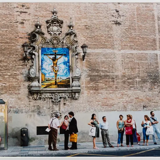 unsigned framed photograph - people in street  H-250 W-380 (slight scratching to frame)