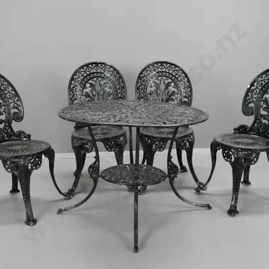 cast alloy black painted patio table and 4 chairs table has lower shelf and umbrella holes - warping to table top, needs