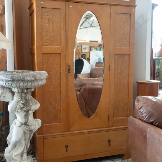 oak arts & crafts single door wardrobe, oval bevelled edge mirror in door, lower boot drawer with drop handles, interior