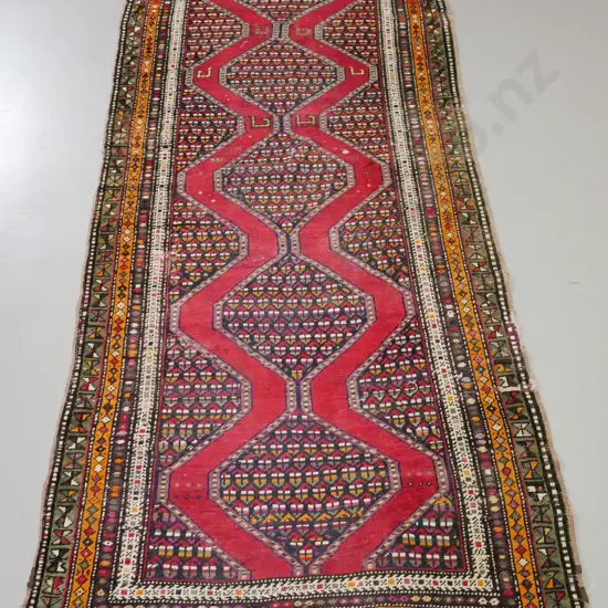 Persian style hand-knotted wool floor rug - red bands and multi-colour border, repairs to edge and patches, overall