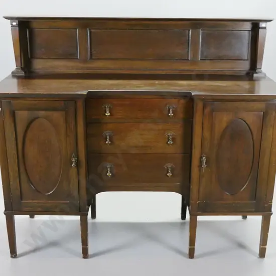 oak arts & crafts sideboard with panelled back with square tapered columns, inverted break front, 2 cupboard doors and 3