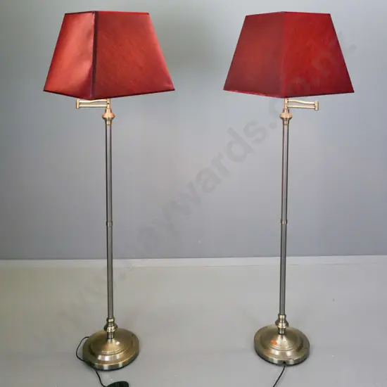 pair of metal swing-adjustable fluted column standard lamps with foot switches, crimson square tapered shades - some