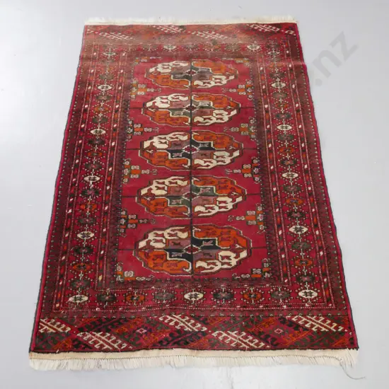 small Persian style hand knotted wool floor rug - fading to one end L-1310 W-890