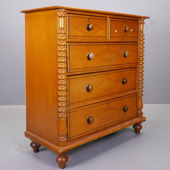 colonial kauri 5-drawer chest with bobbin-turned half columns, round timber knobs, carved shield decoration to drawer