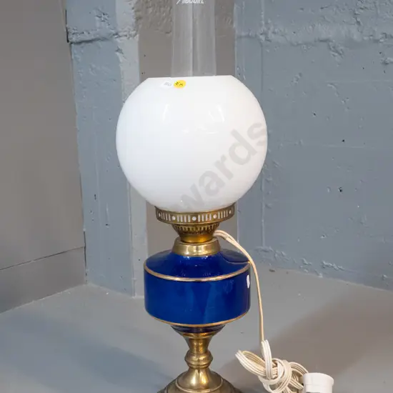 vintage kerosene lamp modified with electrical fitting - blue glass and brass base, milk glass shade and modern