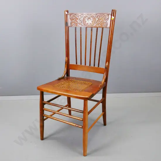 vintage beech pressed back side chair with turned spindle back and stretcher base, cane seat, some scratching to seat