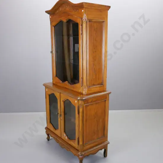 reproduction oak and elm display cabinet with single top and 2 lower glazed shaped cupboard doors, mirrored back on top,