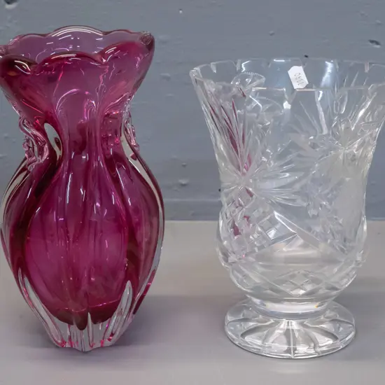 cranberry ribbed heavy art glass vase with floral motifs H-225 and a cut crystal footed vase