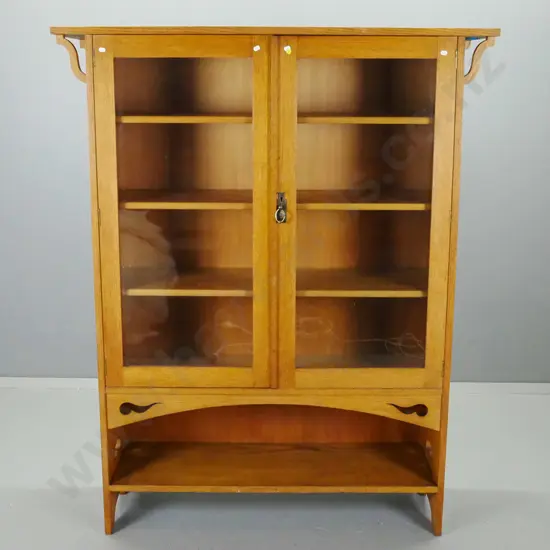 vintage oak arts & crafts style display case w/ 2 glazed doors, 3 shelves, above single open shelf, pierced cutouts to