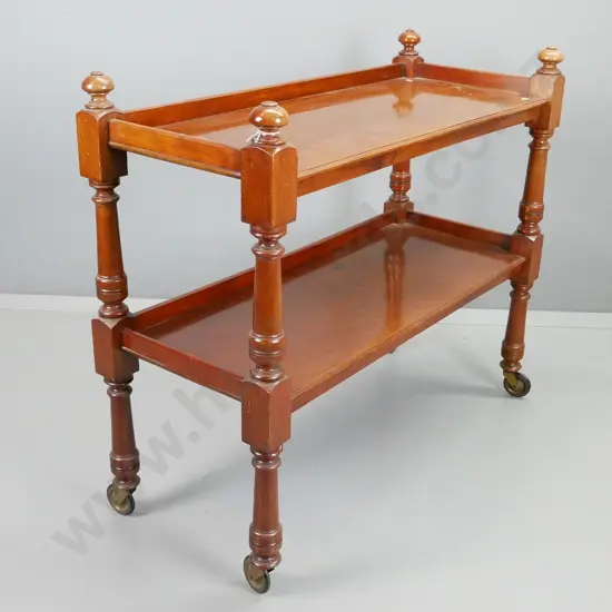 Victorian mahogany 2-tier dumb waiter with turned supports and finials, large metal casters H-910 W-1060 D-400