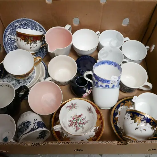 box of odd tea cups, plates, saucers