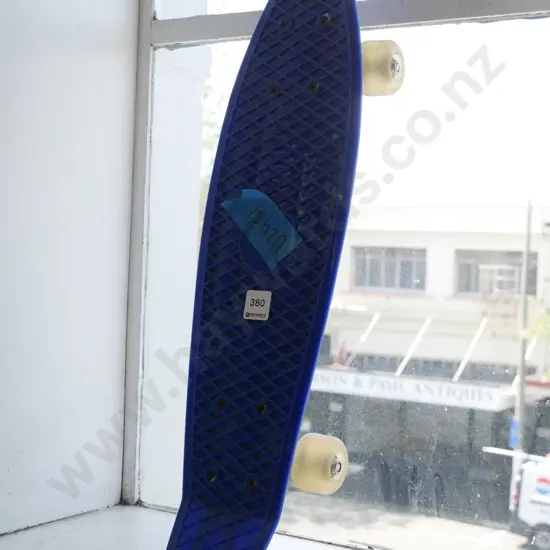 small blue plastic skateboard
