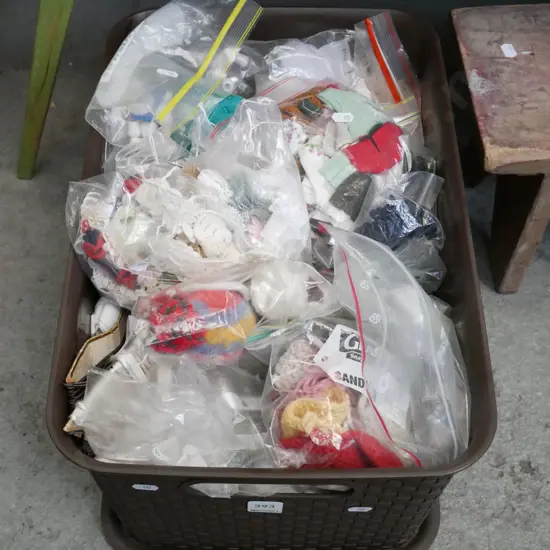 plastic container of sewing accessories