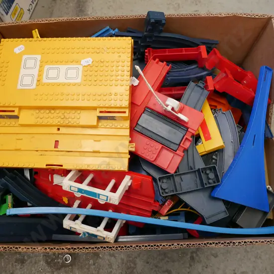 box of plastic Tomy railway tracks etc.