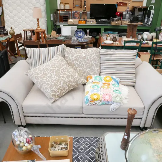 contemporary cream upholstered rolled arm 3 seater settee with matching cushions