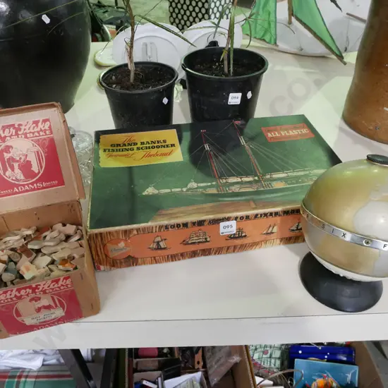 early transistor radio world globe, yet to be assembled plastic ship's model, puzzle