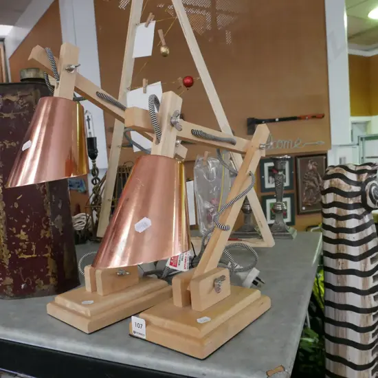 pair of wood and copper anglepoise desk lamps