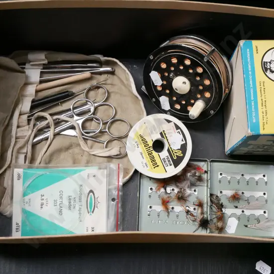 fly fishing reel, flies, tieing equipment