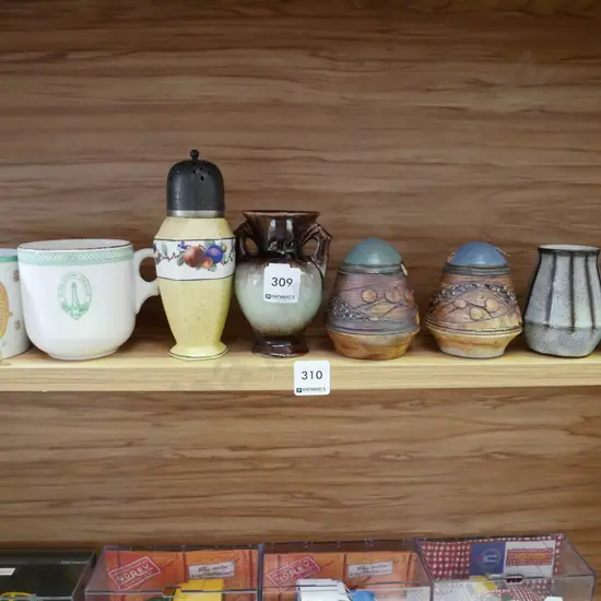 shelf; sugar shaker, cups, salt and peeper etc