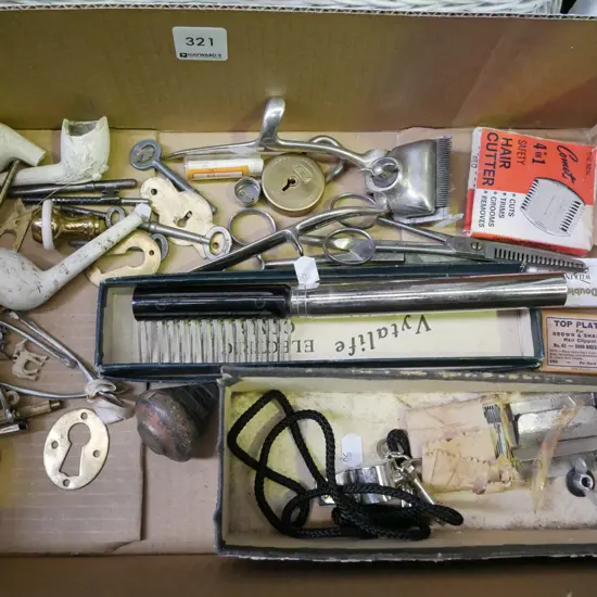 box; electric comb, whistle, clay pipes etc