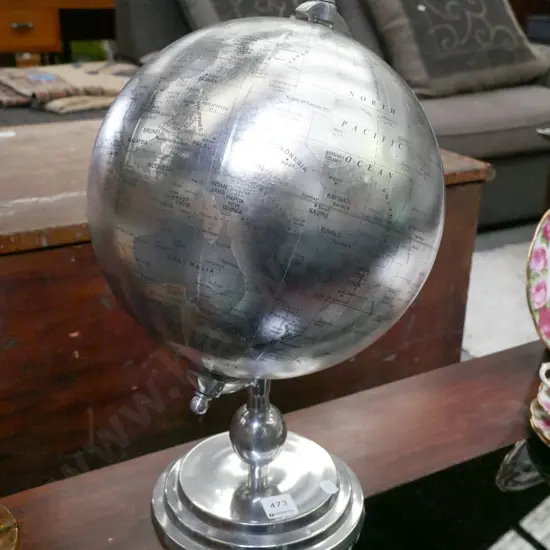 silver world globe