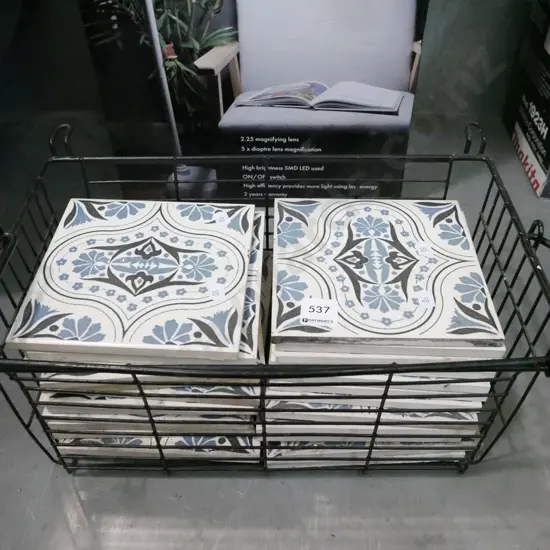 wire basket, blue and white floor tiles