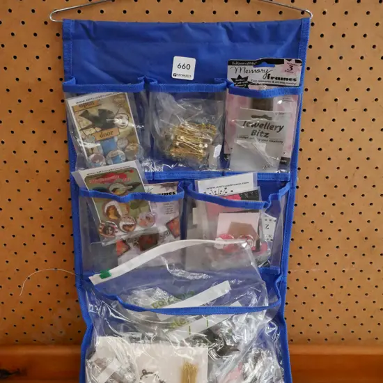 wall storage pockets with crafter's badges, clasps etc