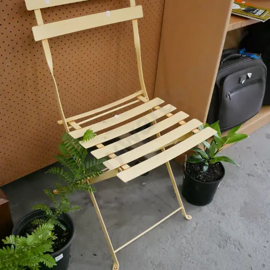 yellow metal deck chair - slight rusting