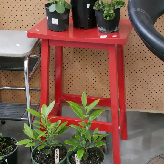 red painted wooden stool