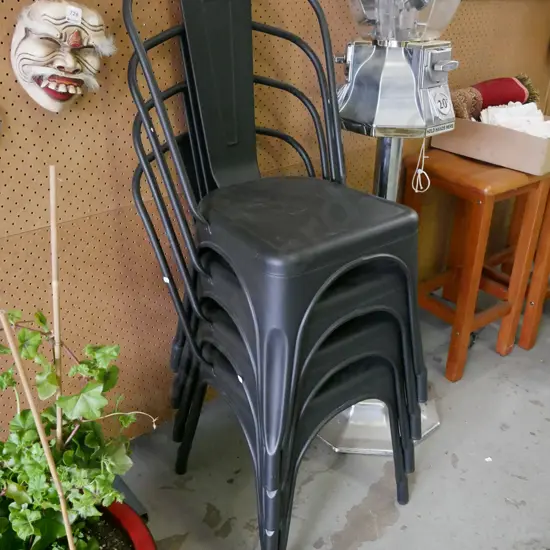 4x black metal stacker chairs