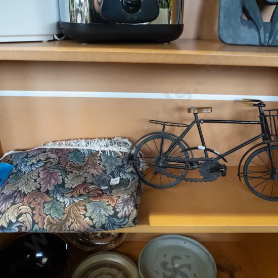 model bicycle and a tablecloth