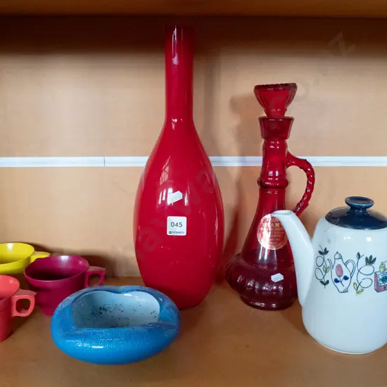 shelf: glass vase, decanter, teapot, ashtray, plastic cups