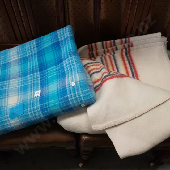 one white and one blue check woollen blankets