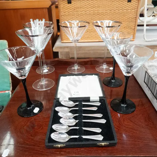 cocktail glasses and a plated teaspoon set