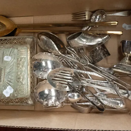 box of plated cutlery, brass salad servers, etc.